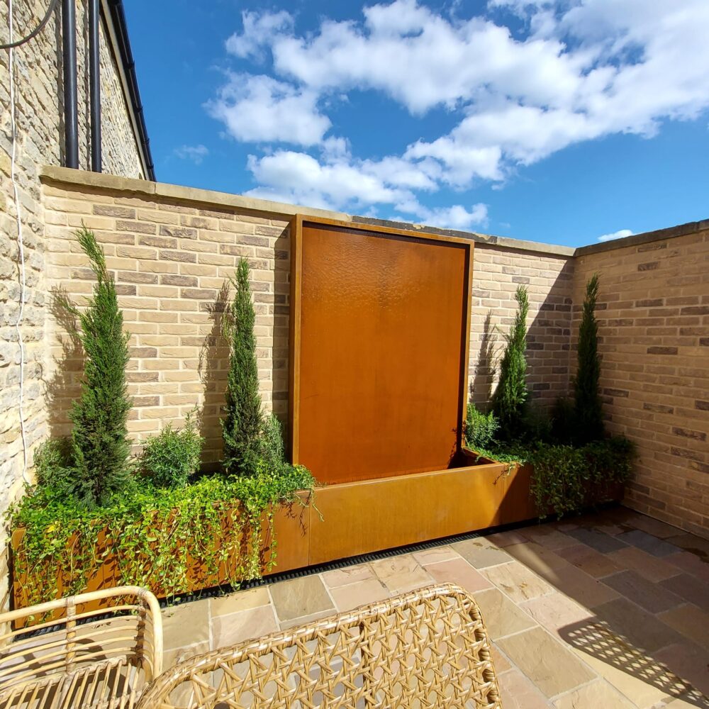 Bespoke Corten waterfall feature with side planters